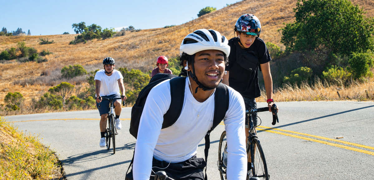 Cyclists riding together on a scenic country road